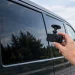 Can I fit a dash cam behind tinted van windows?